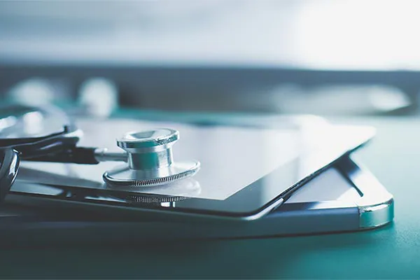 Advanced-Diagnostic-Testing-Clinic Close up of a stethoscope lying on a tablet, representing advanced functional medicine testing offered by Marina Fay, PA-C in Aventura-North Miami.