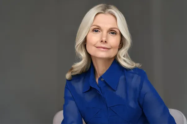GHK-Cu-Peptide-Clinic A mature woman with lustrous hair and skin. Get GHK-Cu peptides for skin and hair from Marina Fay, PA-C in Aventura-North Miami.