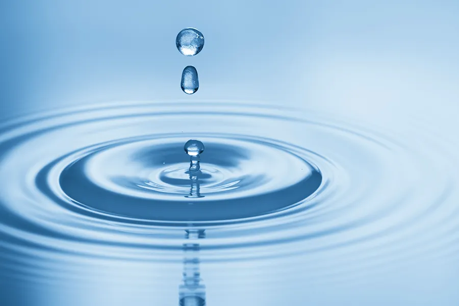 Hydration-IV-Therapy-Clinic Drops of water rippling in a smooth pool. Get Hydration IV Therapy from Marina Fay, PA-C in Aventura-North Miami.