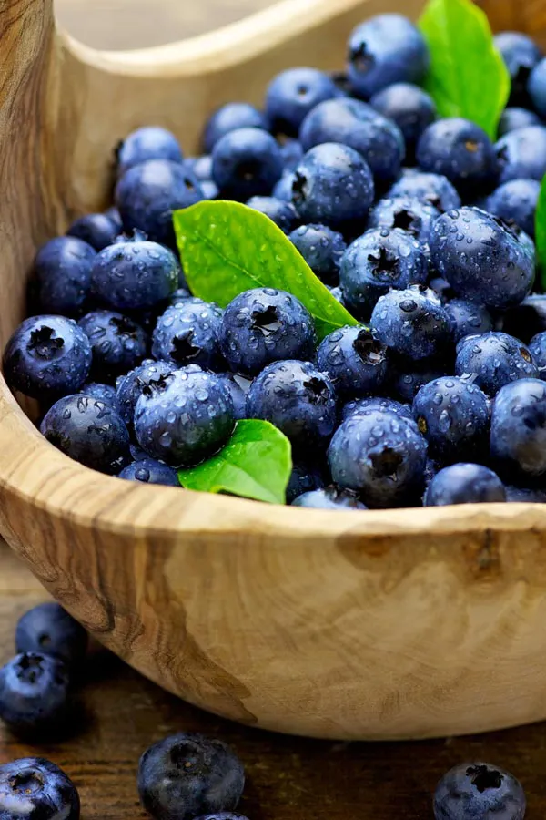 IV-Therapy-Treatment A bowl of refreshing, nourishing blueberries in a wooden bowl, representing IV therapy from Marina Fay, PA-C in Aventura-North Miami.