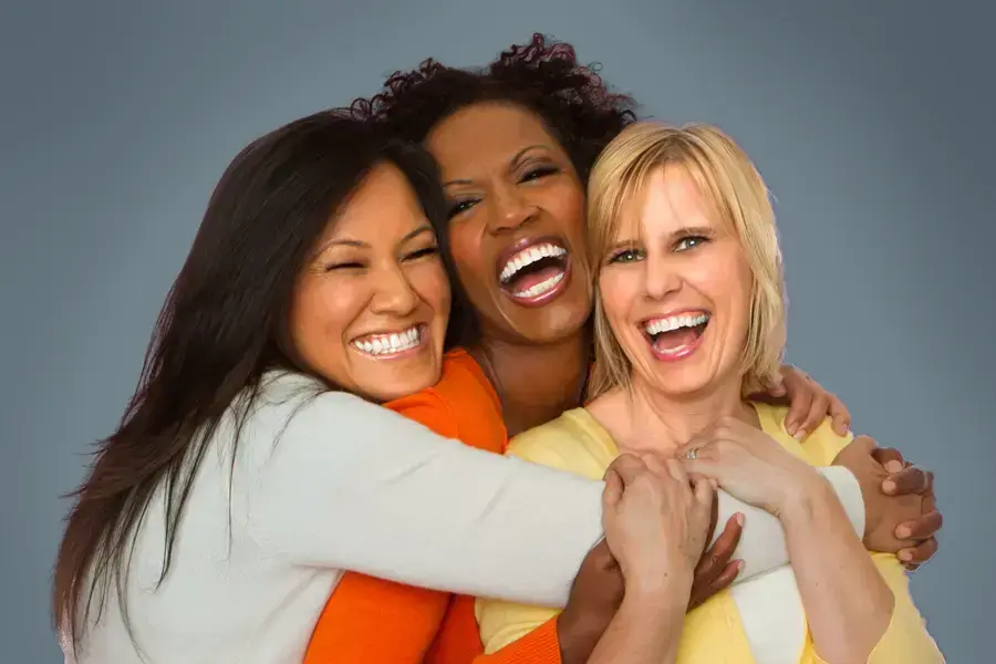 Insulin-Resistance-Clinic An asian, black, and white woman of middle age hug and laugh. Get insulin resistance treatment from Marina Fay, PA-C in Aventura-North Miami.