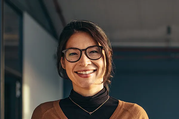 Metabolic-Syndrome-Clinic A brunette woman with glasses smiles in a gray-blue walled office. Get metabolic syndrome from Marina Fay, PA-C in Aventura-North Miami.