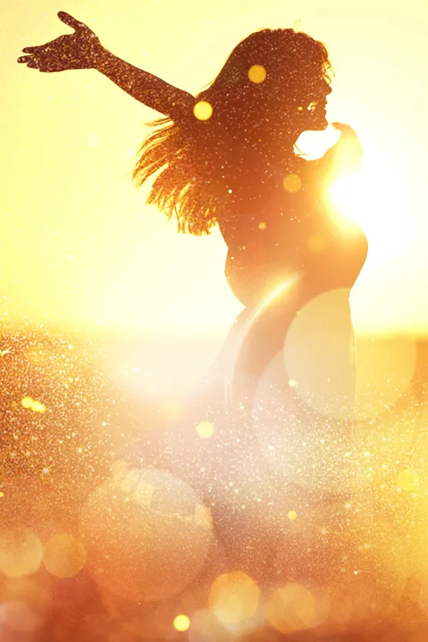 Neuro-Longevity-Peptides-Treatment A woman with outstretched arms in the sunset. Get Neuro-Longevity Peptides treatment from Marina Fay, PA-C in Aventura-North Miami.