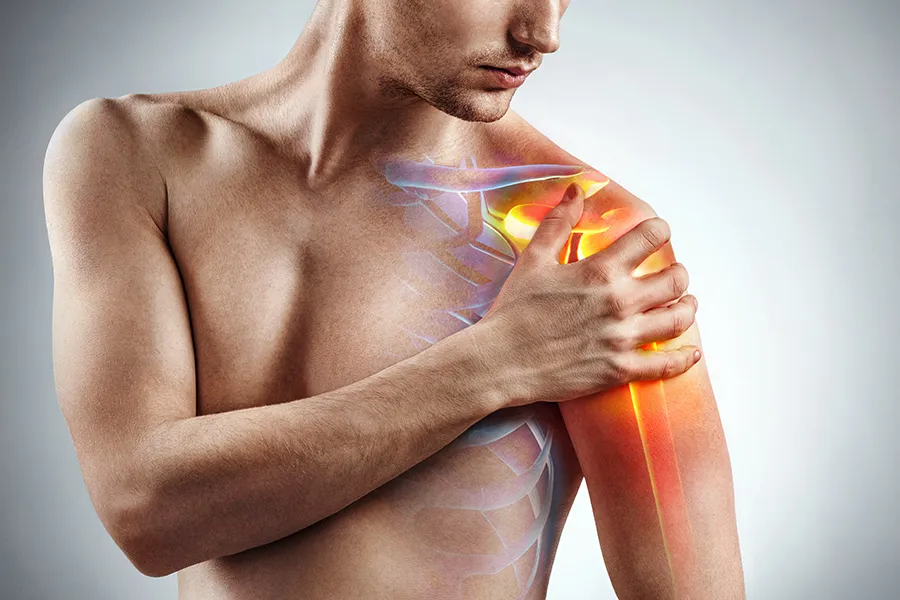 PRF-Injections-for-Joint-Health-Clinic A man holds his shoulder, with an illustrated x-ray showing pain. Schedule PRF Injections for Joint Health from Marina Fay, PA-C in Aventura-North Miami.
