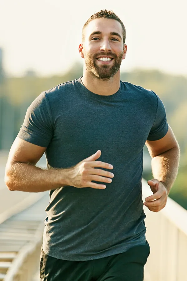 PRP-for-Joint-Pain-Treatment A man happily running for exercise. Get PRP for joint pain from Marina Fay, PA-C in Aventura-North Miami.