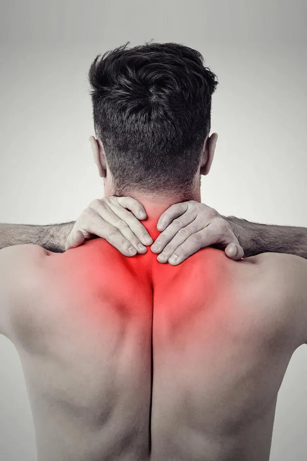Regenerative-Medicine-for-Back-Pain-Treatment A man holds his upper back in pain. Get Regenerative Medicine for Back Pain from Marina Fay, PA-C in Aventura-North Miami.