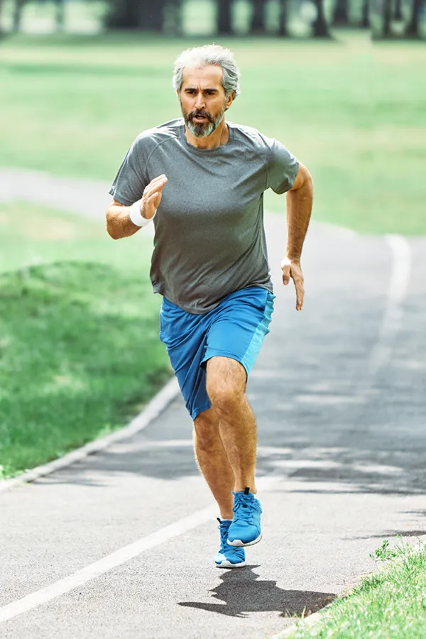 Regenerative-Medicine-for-Injury-Rehabilitation-Treatment A middle-aged man running on a track. Get Regenerative Medicine for Injury Rehabilitation from Marina Fay, PA-C in Aventura-North Miami.