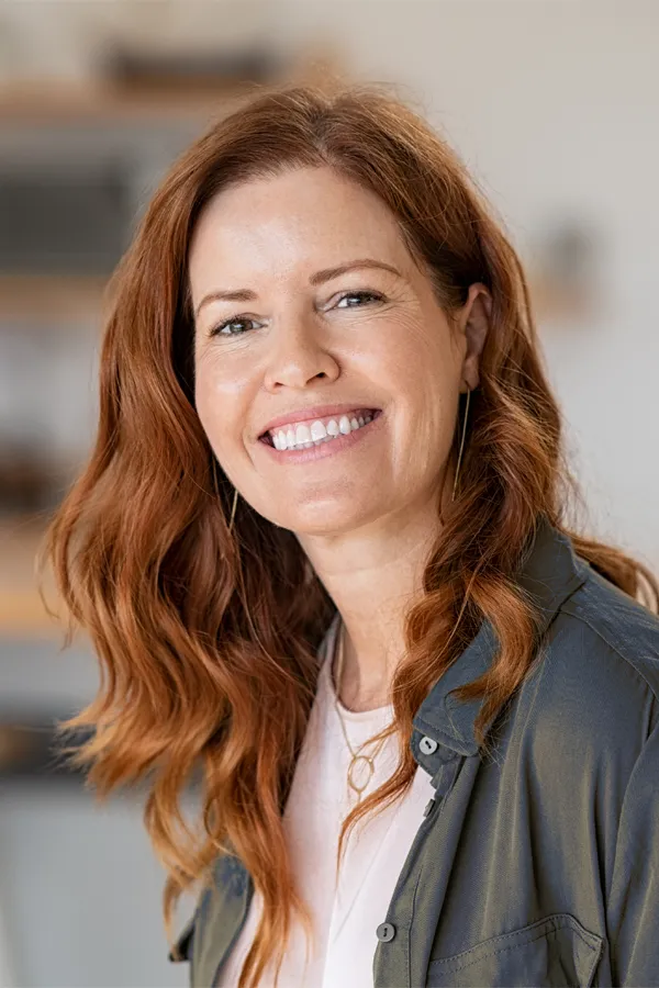 Skin-and-Hair-Peptides-Treatment A beautiful red-haired woman with full hair and nice skin. Get Skin and Hair Peptide Treatment from Marina Fay, PA-C in Aventura-North Miami.