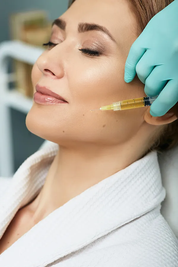 Stem-Cell-Facial-Treatment A woman receiving a facial injection. Get stem cell facial treatment from Marina Fay, PA-C in Aventura-North Miami.